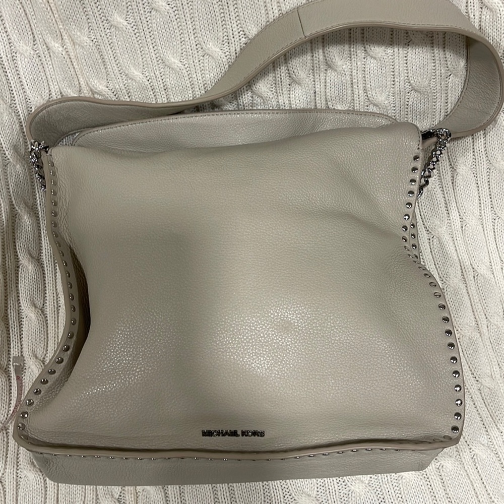 Beautiful Michael Kors soft leather purse. The color is Cement